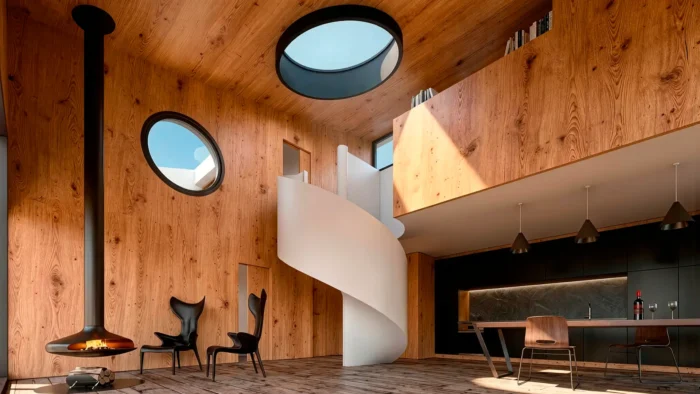 Interior de casa moderna en la montaña con revestimiento de madera, escalera de caracol blanca, óculos circulares y chimenea suspendida.